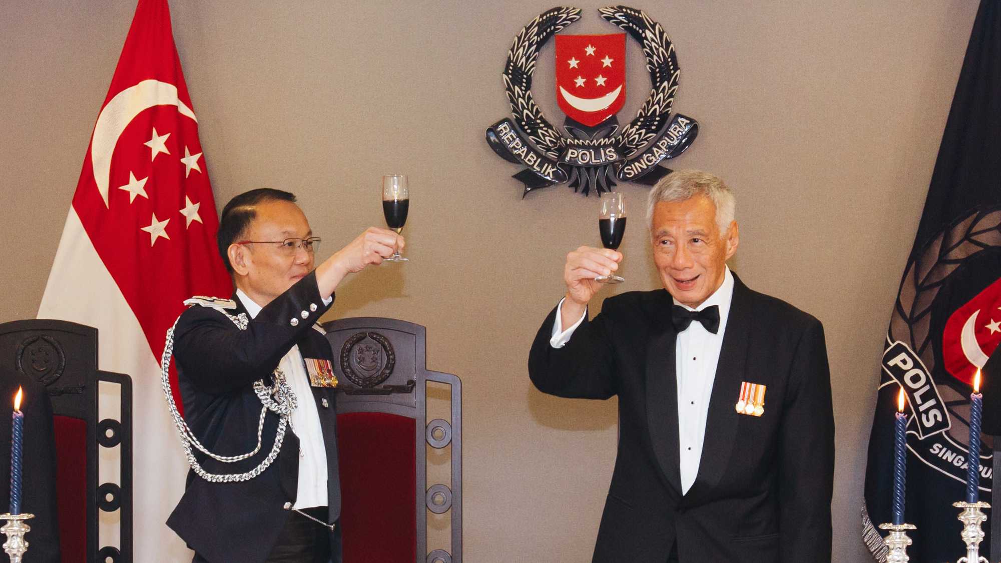 PM Lee Hsien Loong receiving a Loyal Toast from CP Hoong Wee Teck, officers and guests.