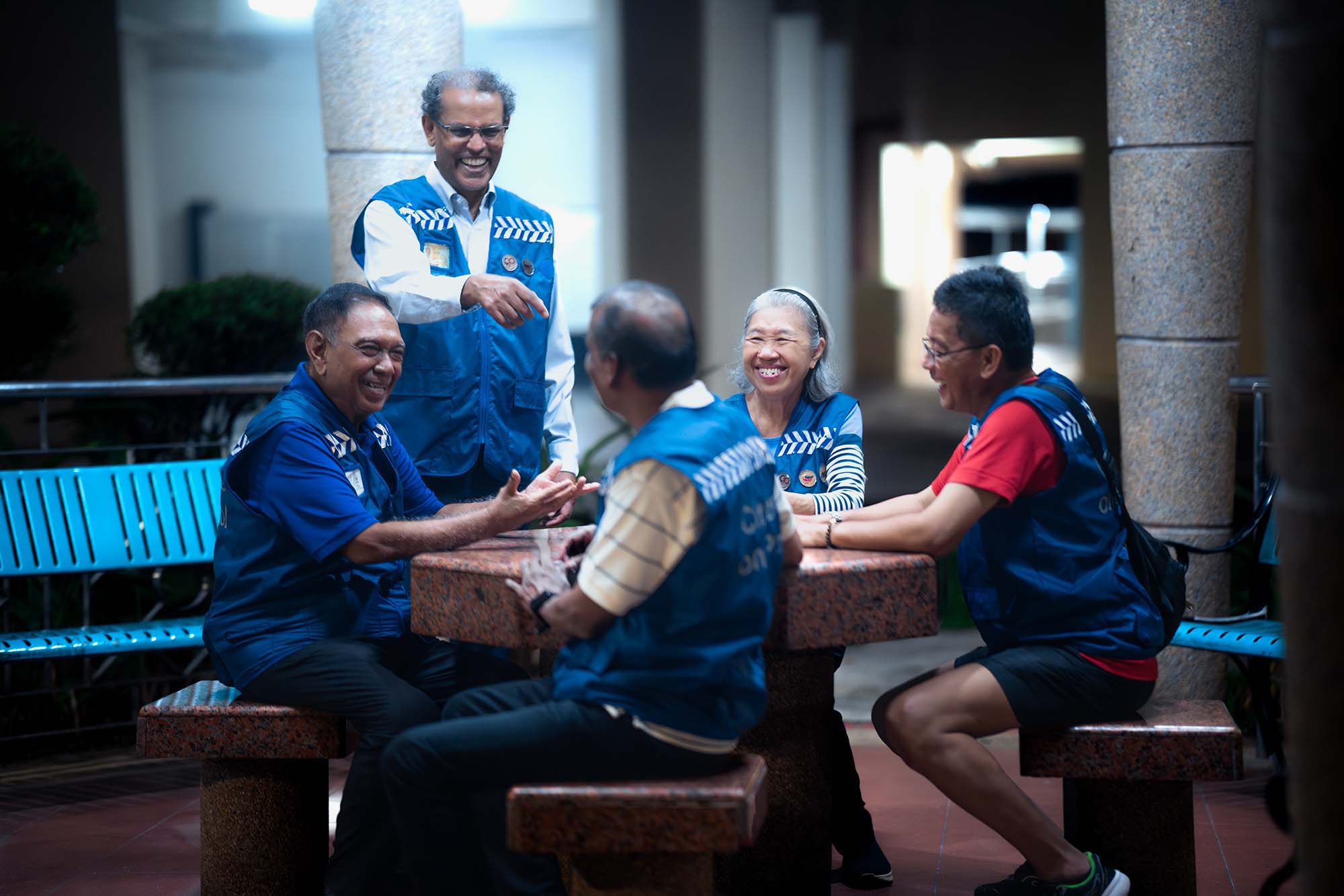 After completing their patrol, Mr Jita and his fellow COP volunteers enjoy a light moment together.