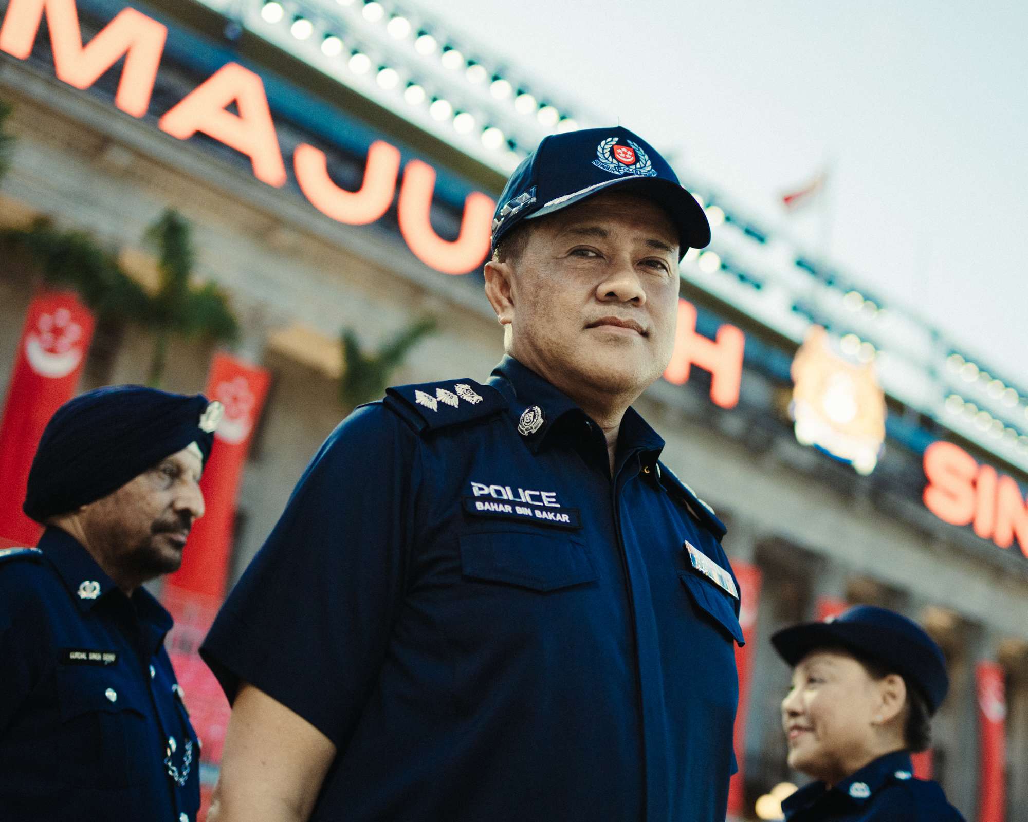 bahar focused and standing infront of the NGS in uniform