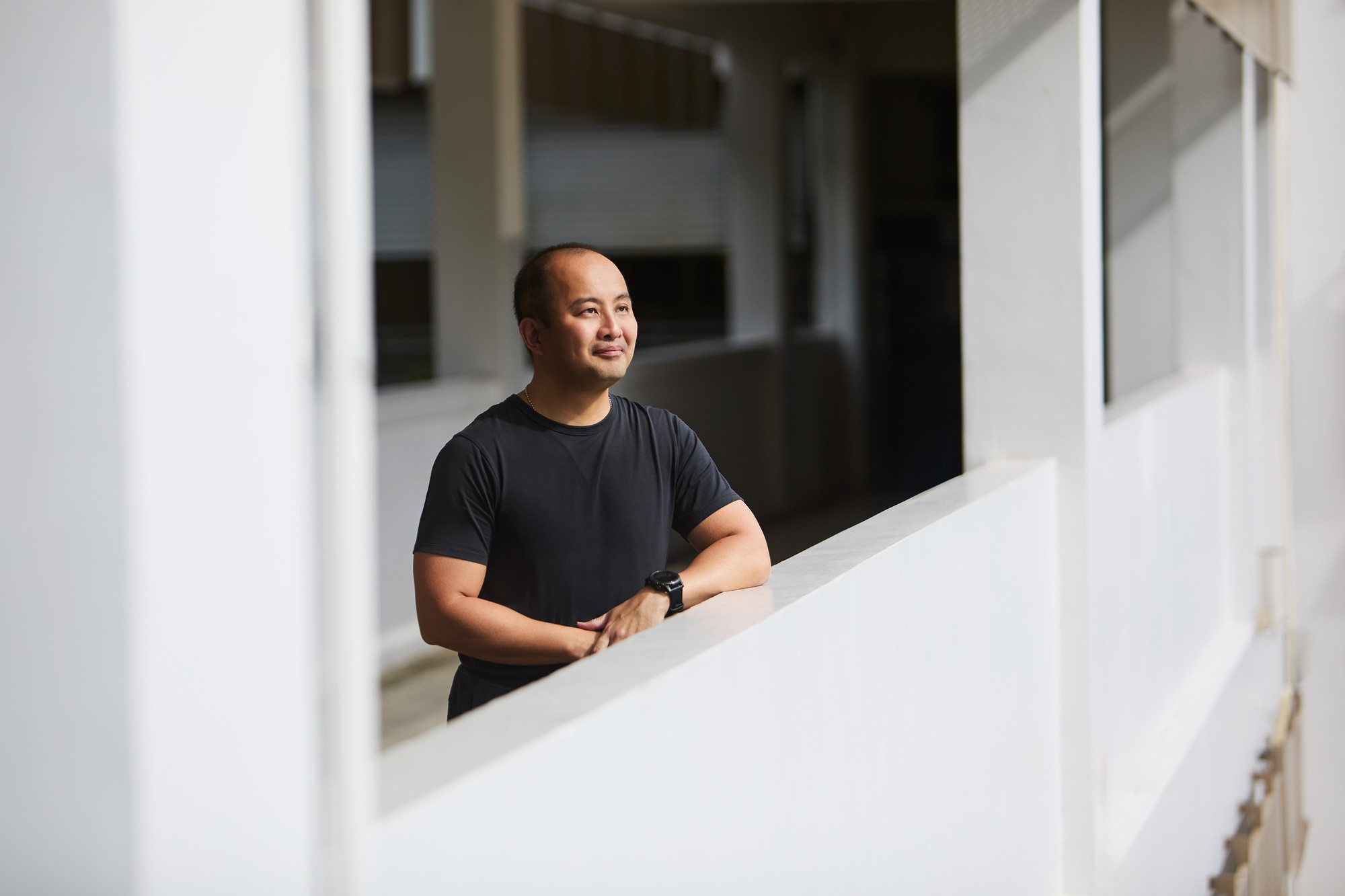 asp marc in his grey top looking over a classroom parapet 